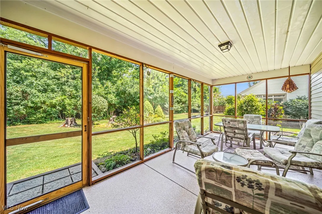 Sunroom with outdoor dining space