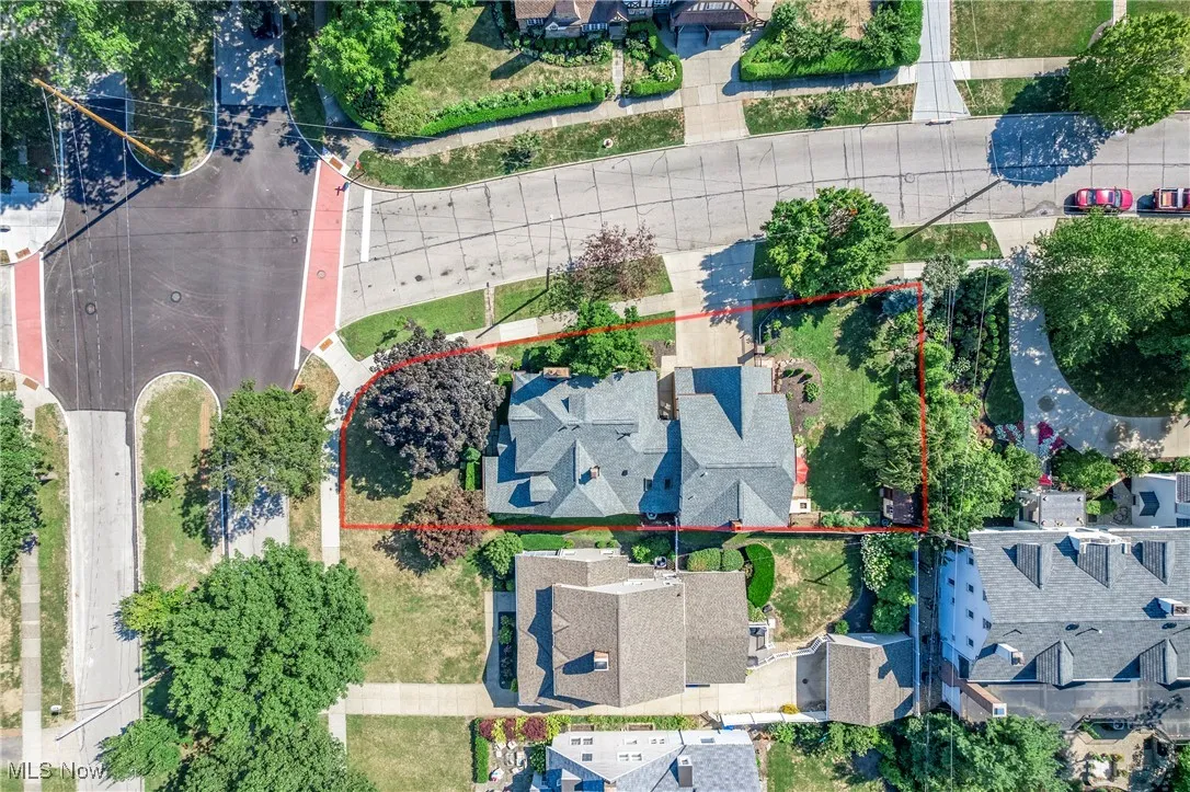 Aerial view of residential area with property boundaries highlighted