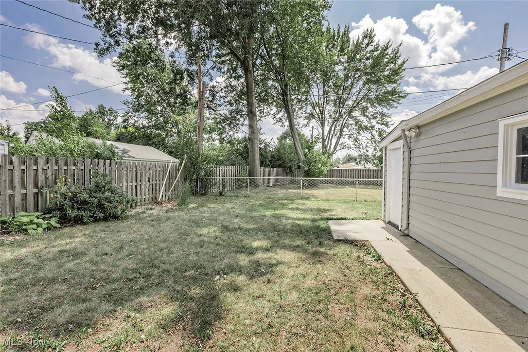 View of fenced backyard