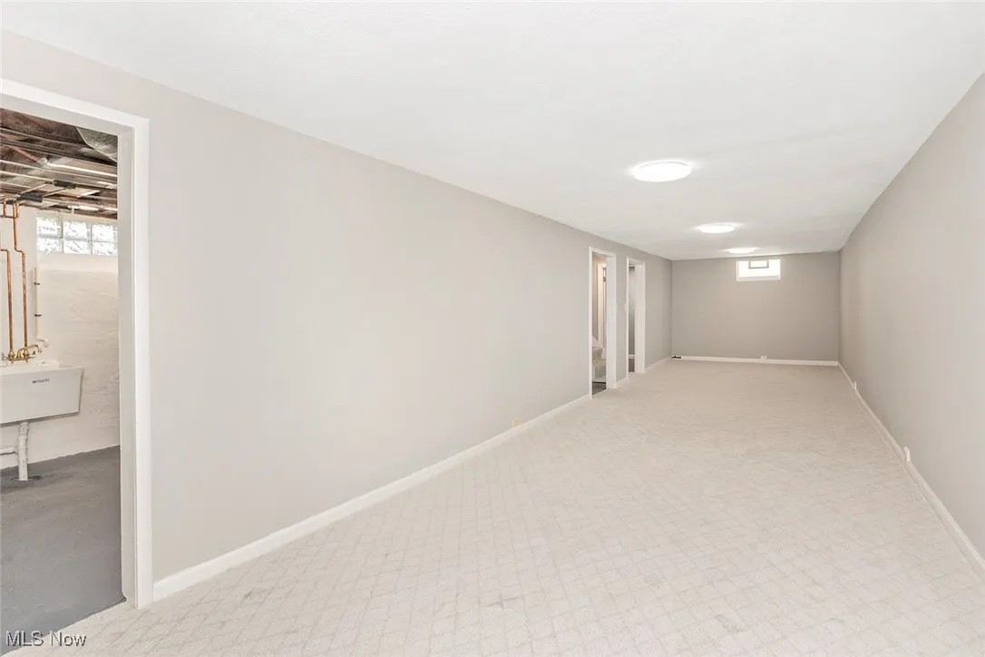 Basement featuring baseboards