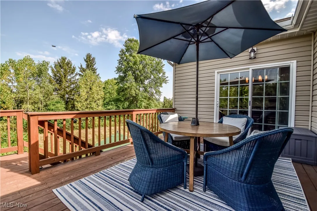 Upper deck with access to lower level patio w built in firepit