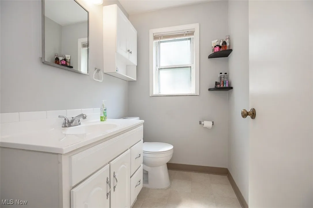 Bathroom with vanity and toilet