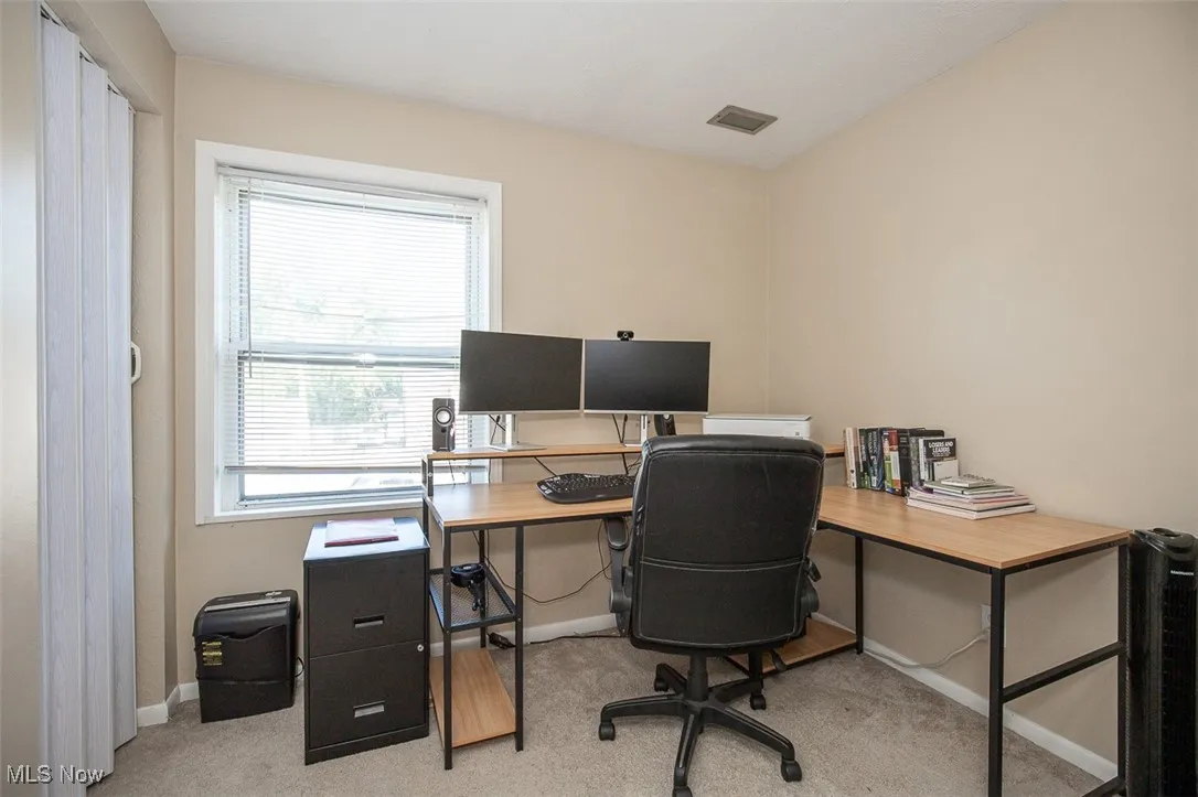 Office space with light colored carpet