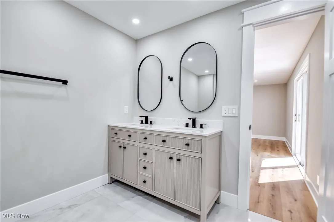 Full bath with double vanity and recessed lighting