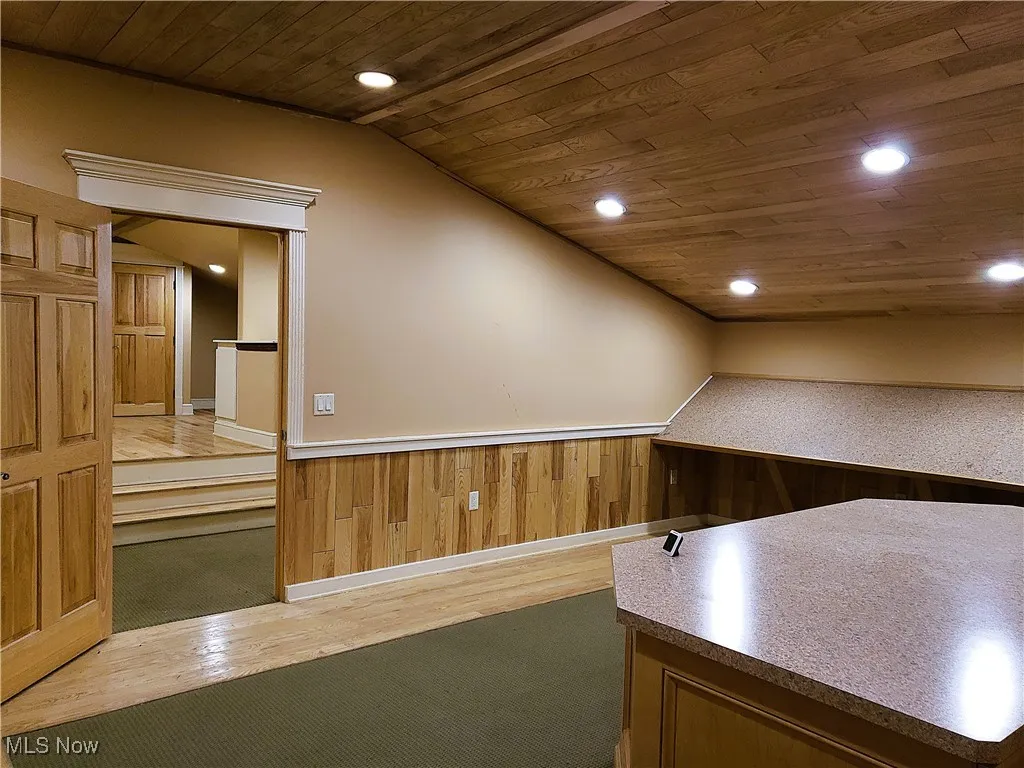 Unfurnished office with wooden ceiling, hardwood / wood-style floors, and recessed lighting