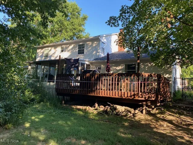 Back of property with a deck