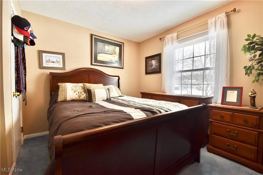 Carpeted bedroom with baseboards