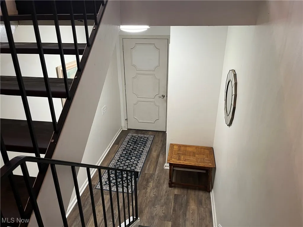 Enter from Front Door to the Foyer on the main floor.  From there you can take the stairs going upstairs or to the lower level.