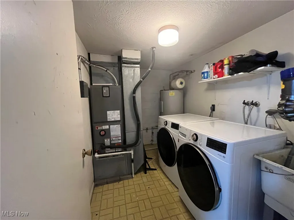 Utility Room is in the Lower Level.  It has the furnace (2022) and the Hot Water Tank (2011).  The washer and dryer do NOT convey with the house.