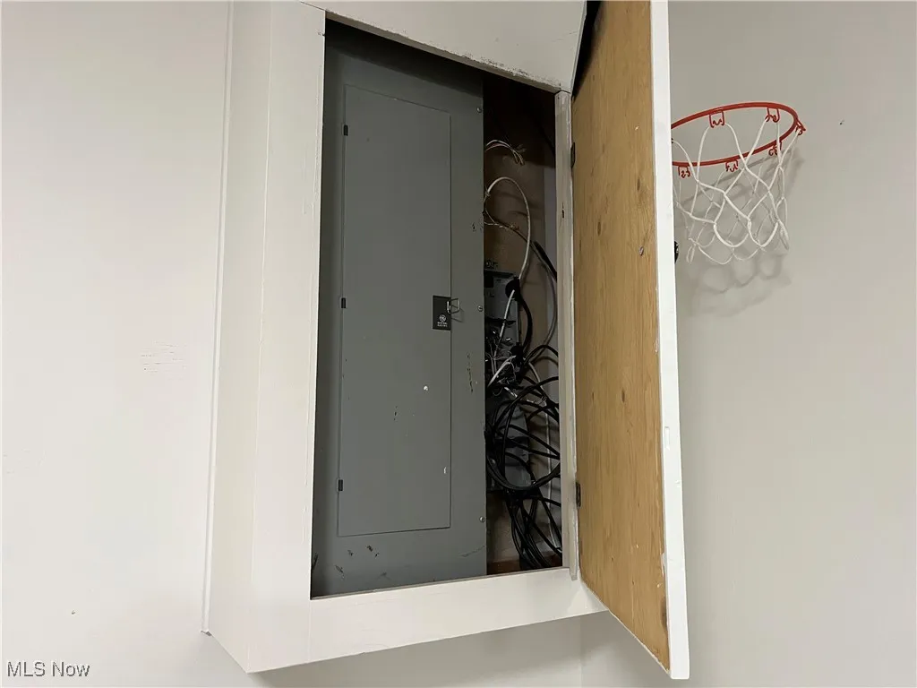 Electric Panel hidden behind the Baseketball Hoop Door.