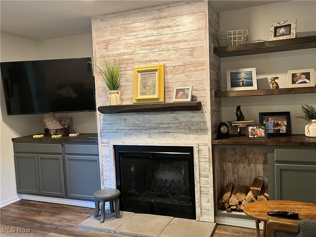 Focal Wall in the Living room features space for a TV, fireplace nd shelves.