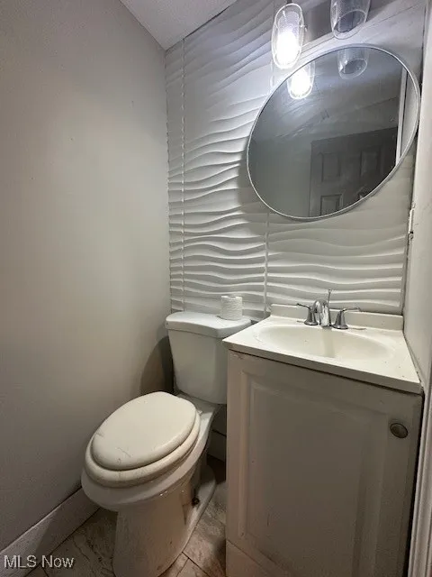 Bathroom with vanity and toilet