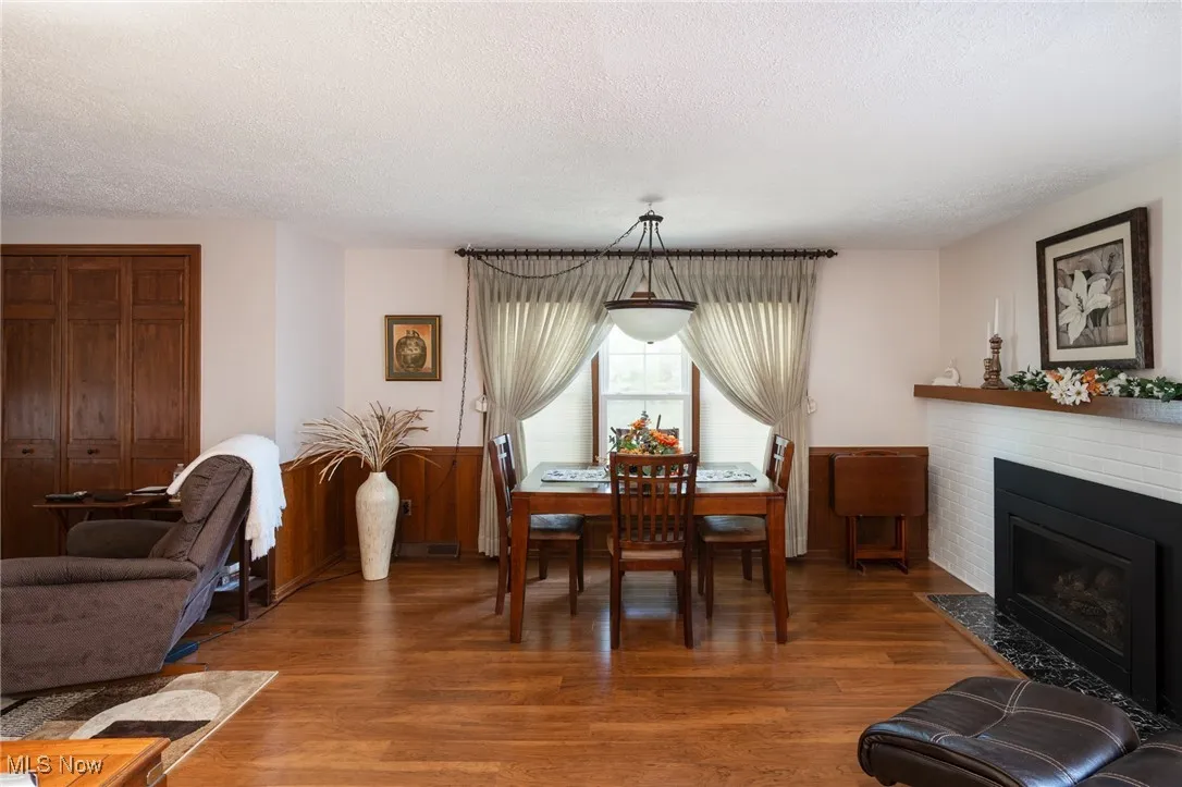 The family room has  a fireplace and could also be set us as a formal dining room as shown here.