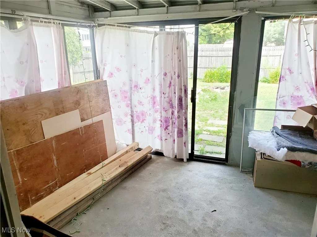 Unfurnished room featuring concrete floors