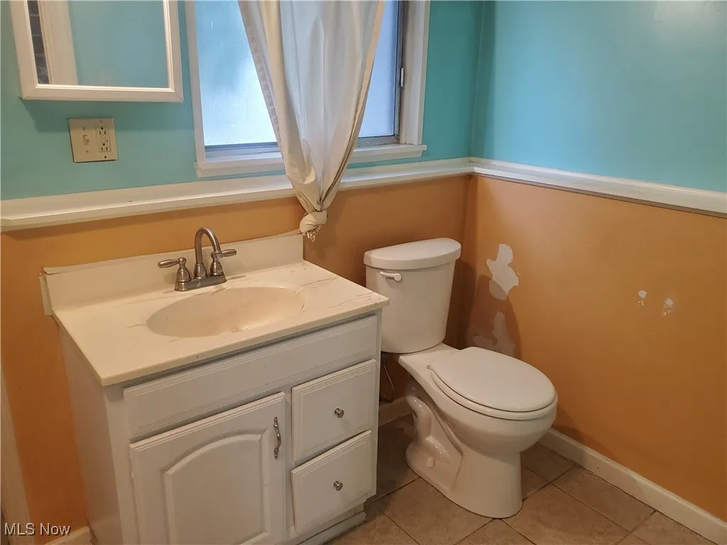 Bathroom featuring vanity and light tile patterned floors