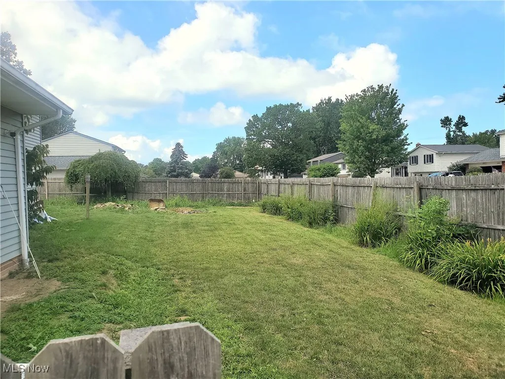 View of fenced backyard