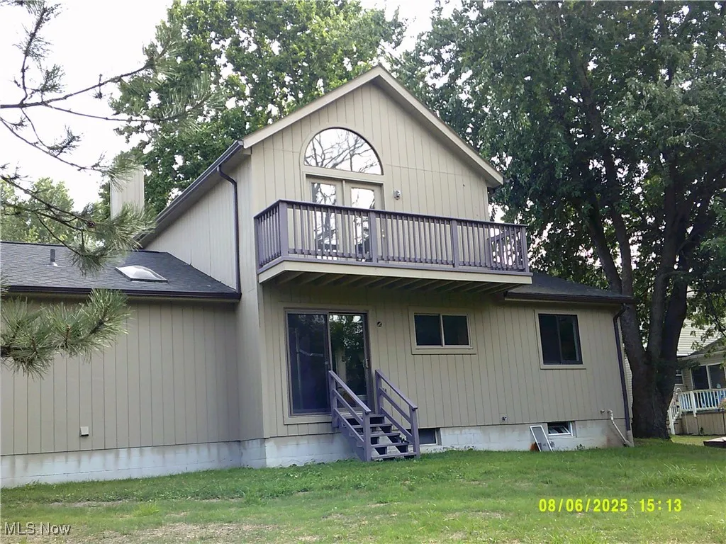 Rear view of house with a balcony