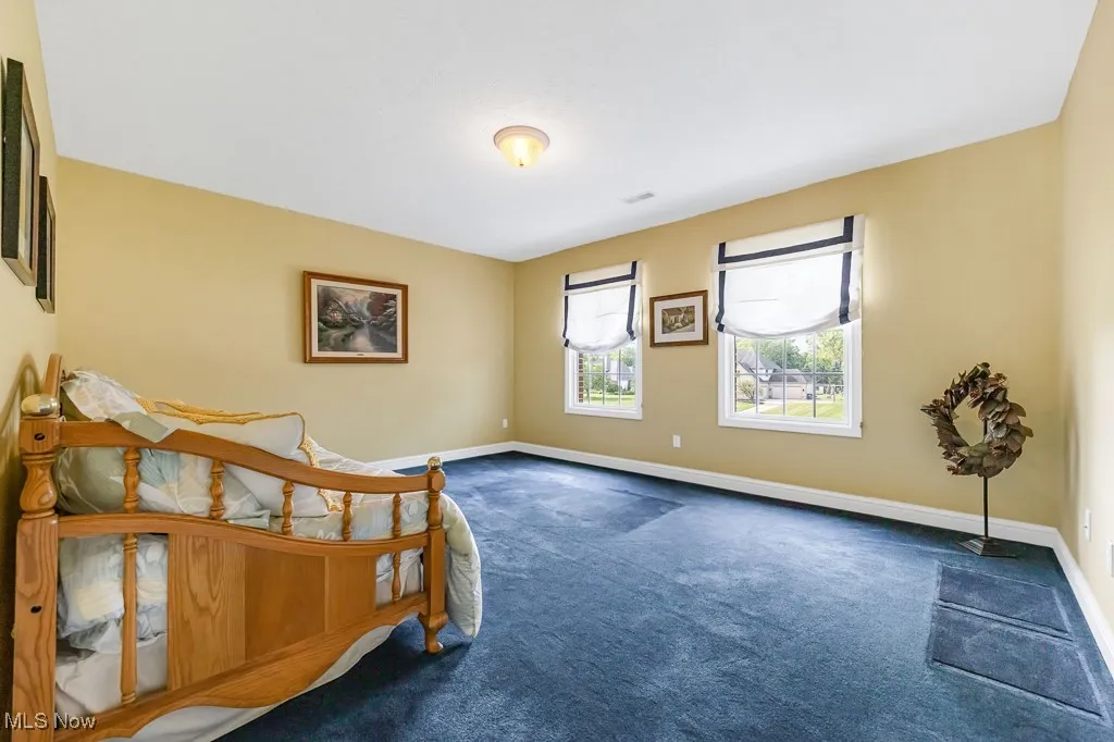 Bedroom with carpet and baseboards