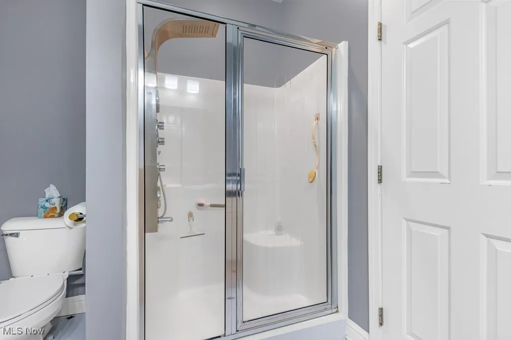 Full bath featuring a stall shower