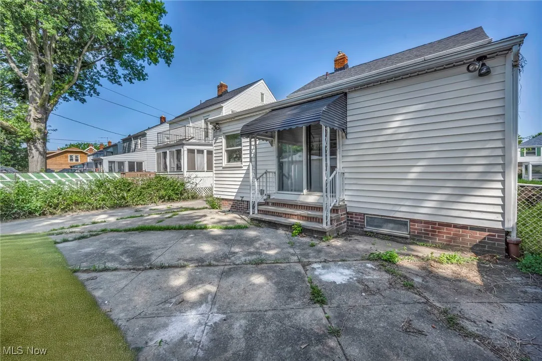 Rear view of property with a chimney