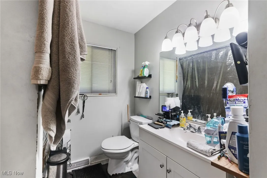 Bathroom with vanity and toilet