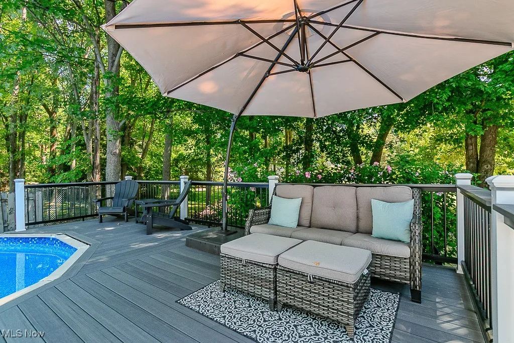 Wooden terrace featuring an outdoor hangout area
