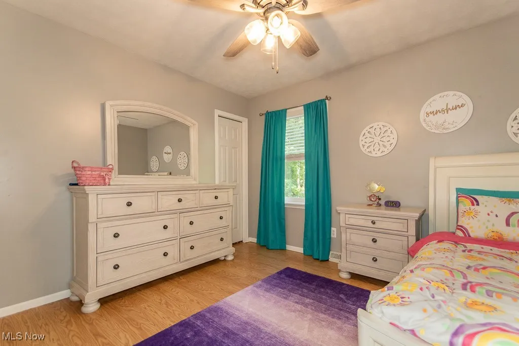 Bedroom with light wood-type flooring and ceiling fan