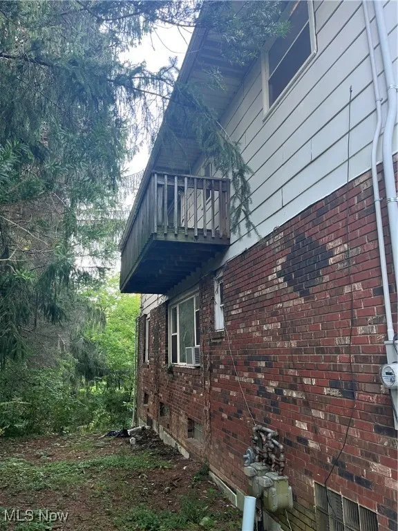 West side of house has a balcony.  Add some steps so upstairs suite has its own access.