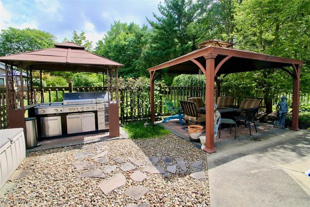 View of patio / terrace featuring a gazebo and exterior kitchen
