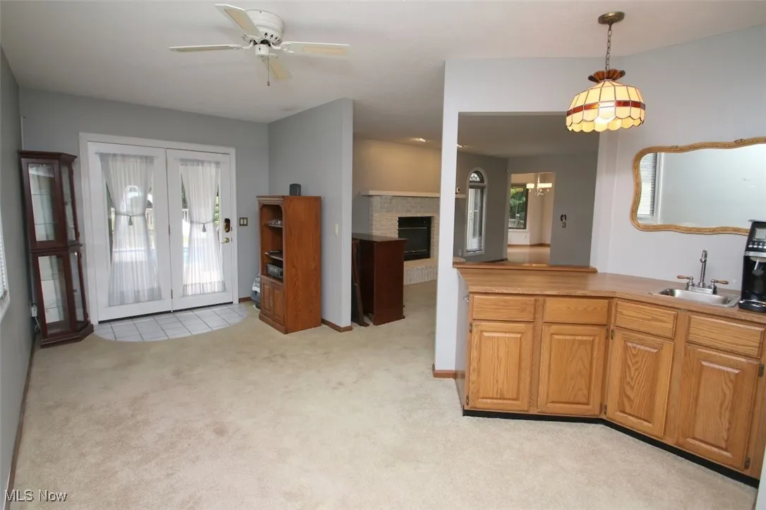 Additional Sitting Area with wet bar and opens to deck with pool