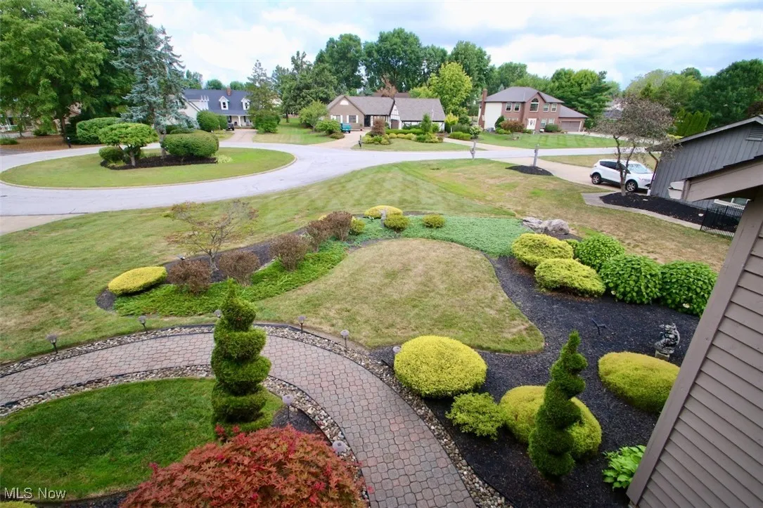 View of grassy yard from upper balcony