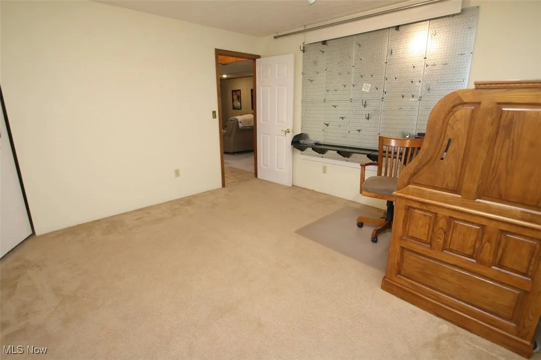 Office space or craft room with light colored carpet