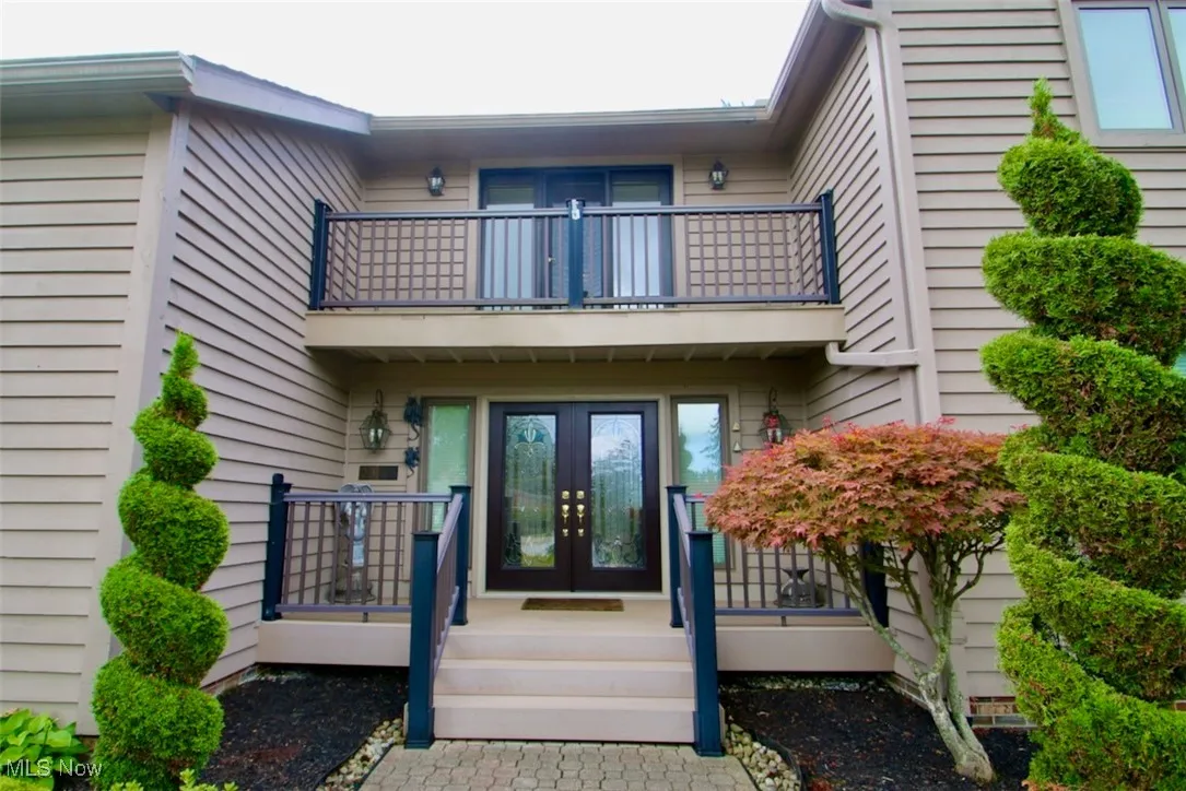 View of exterior entry featuring french doors