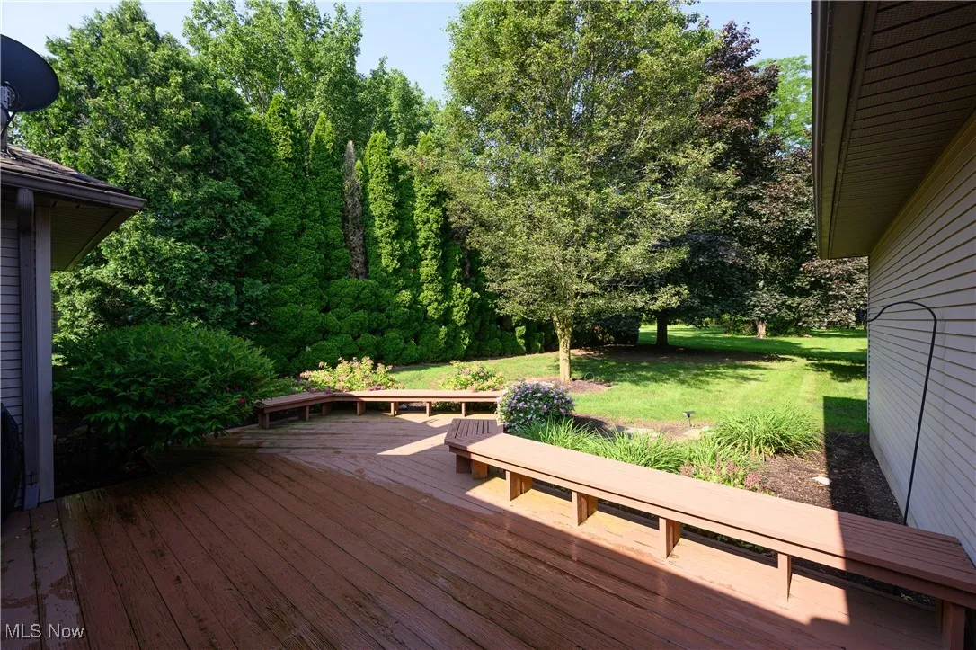 Wooden deck featuring a yard