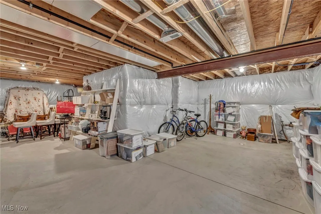 View of unfinished below grade area with lots of storage