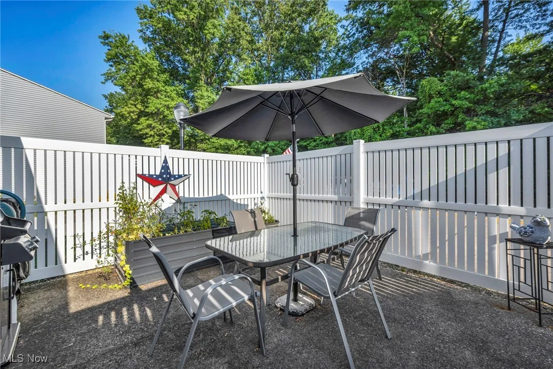 View of patio / terrace featuring outdoor dining space and grilling area