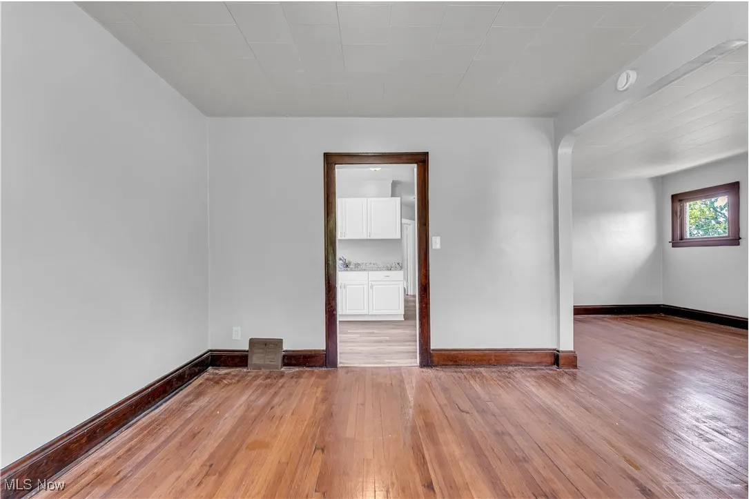 Unfurnished room featuring light wood-style floors and baseboards