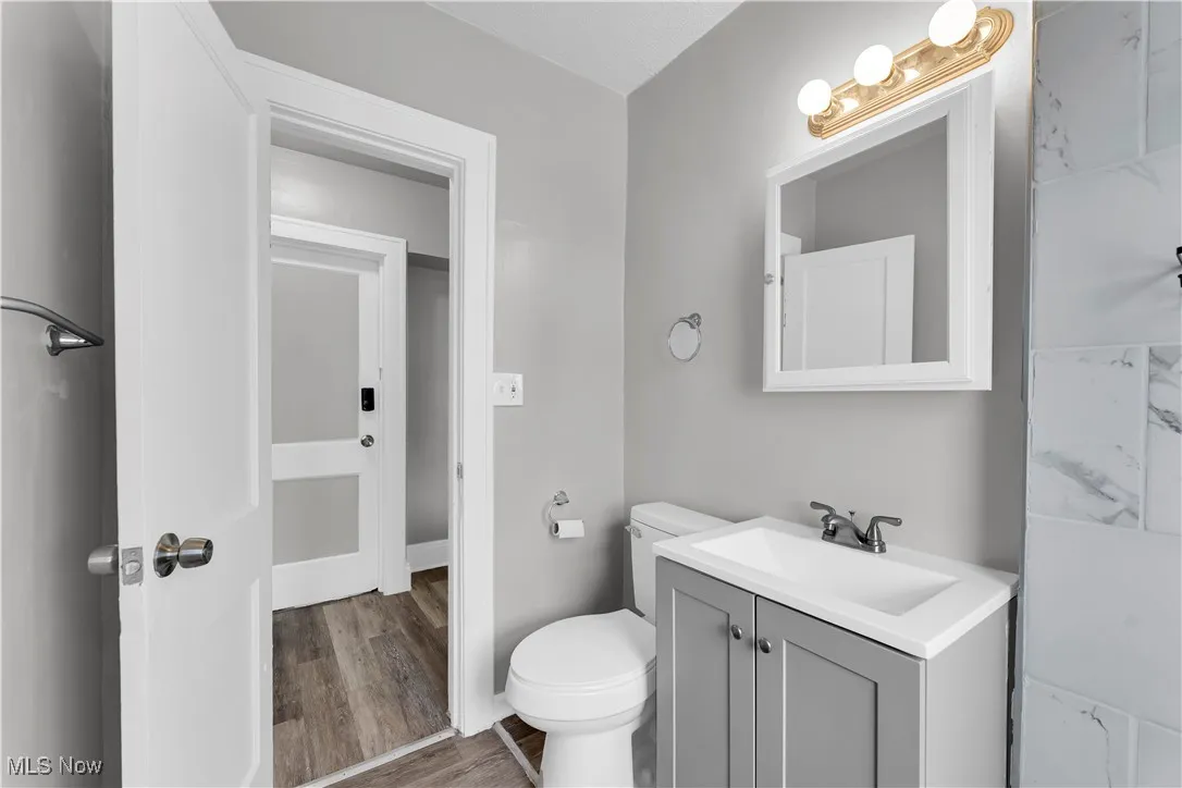 Bathroom featuring vanity and wood finished floors