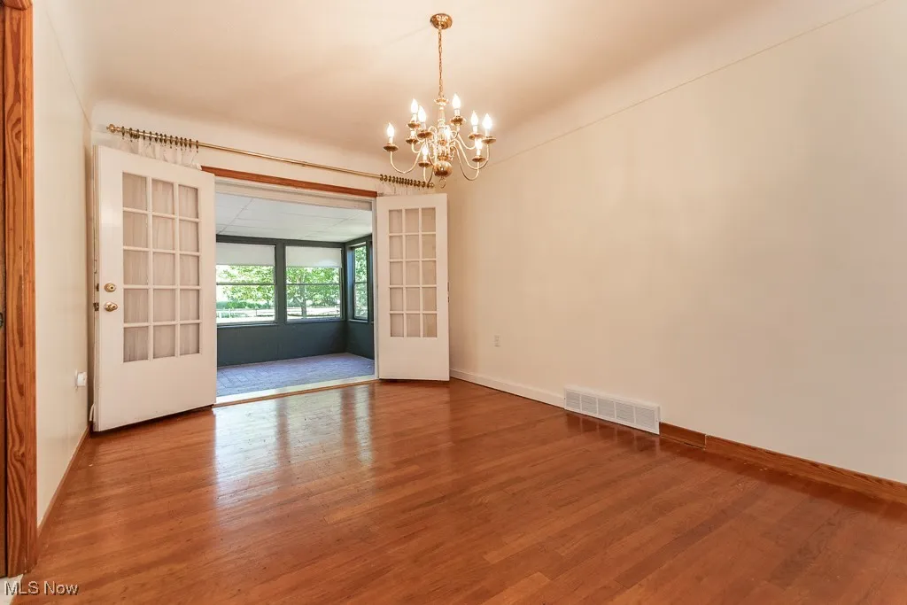 Entry doors open to sunroom