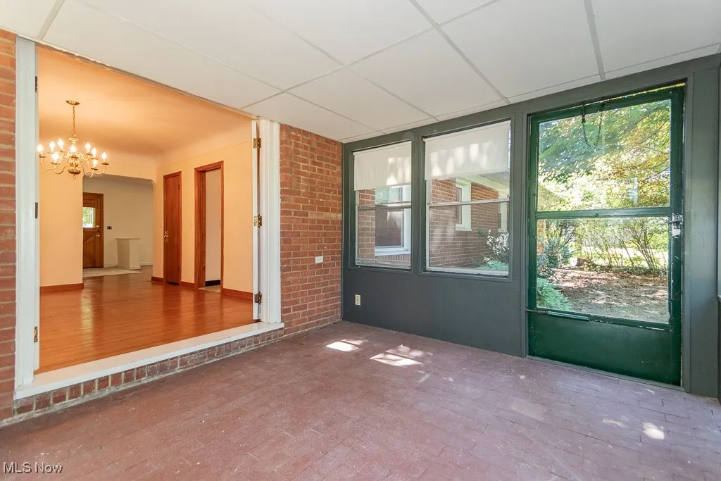 Sunroom with brick floor
