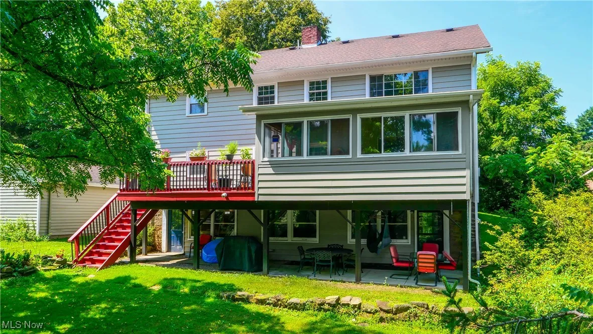 Back of Duplex showing walk out basement lower patio & upper deck
