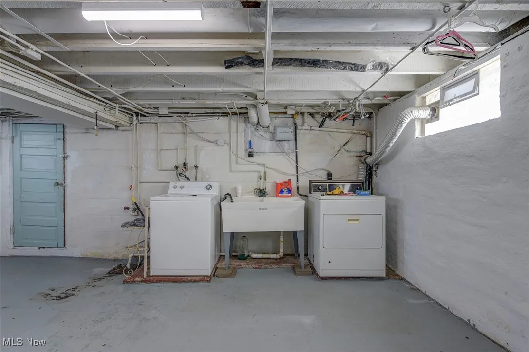 Below grade area with washer and dryer