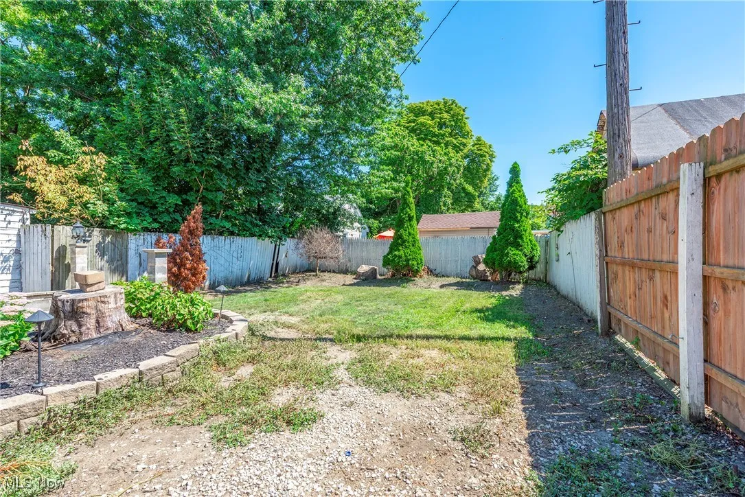 View of fenced backyard