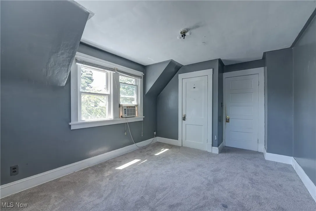 Bonus room featuring carpet and cooling unit