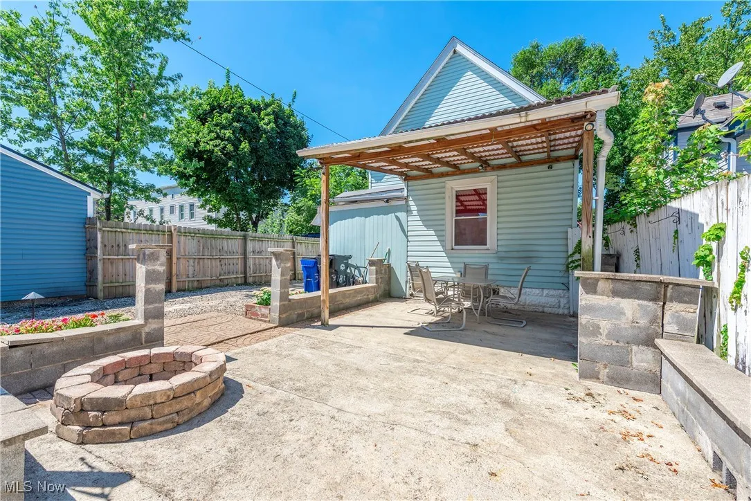 Fenced backyard with a patio area and outdoor dining space