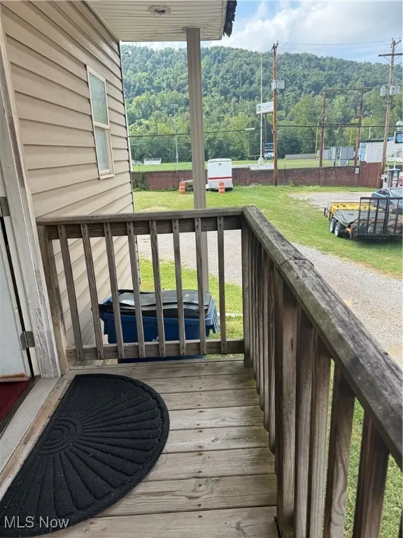 Deck featuring a wooded view