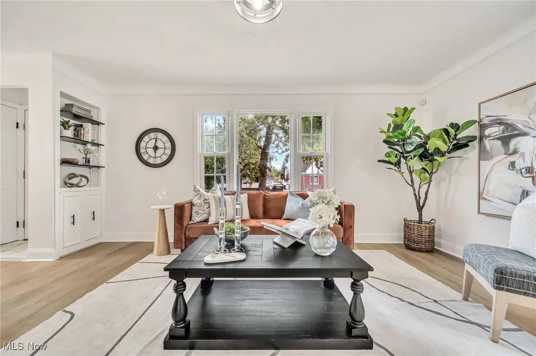Living area with light wood-type flooring and baseboards