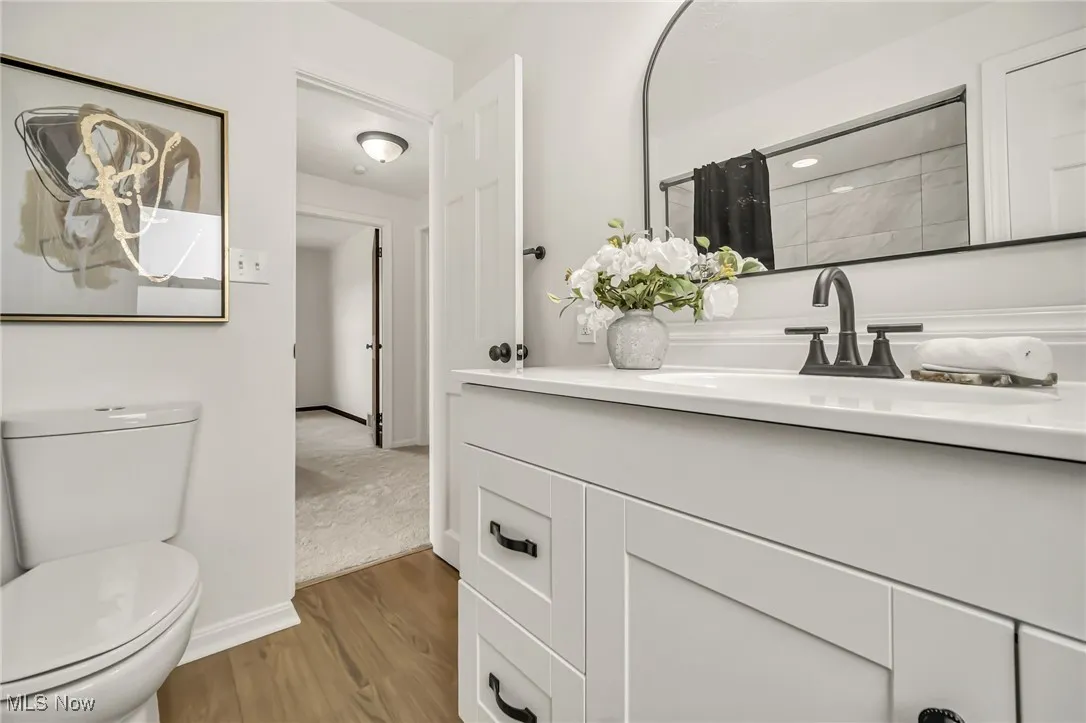 Bathroom featuring vanity and light wood-style flooring