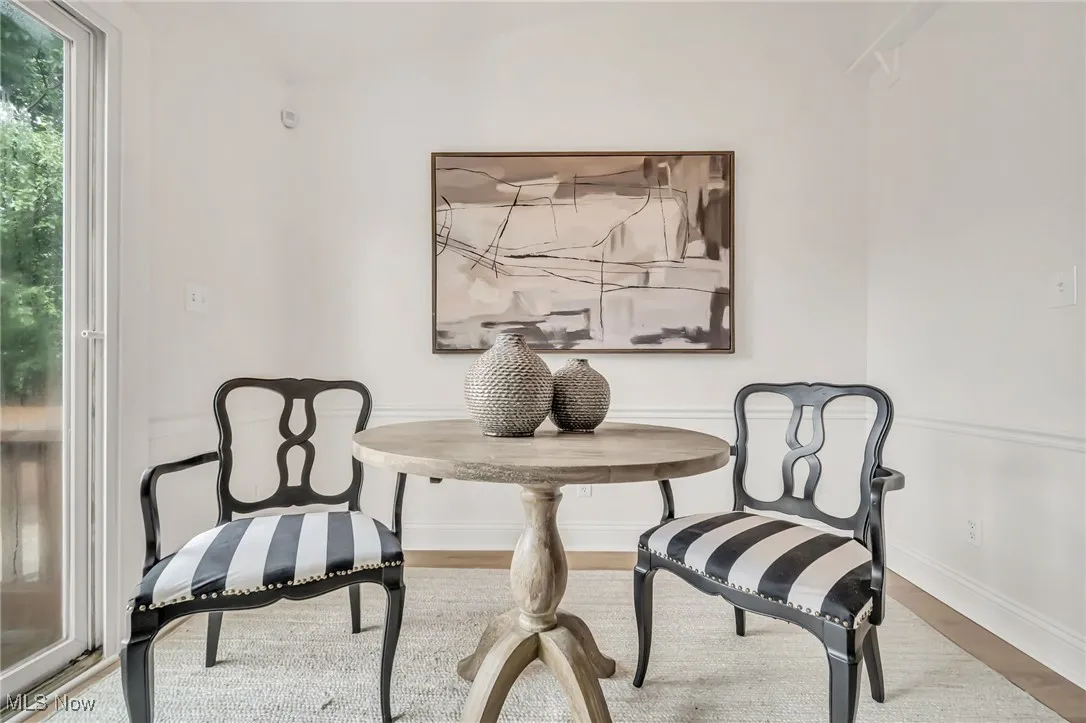 Dining area featuring wood finished floors and baseboards