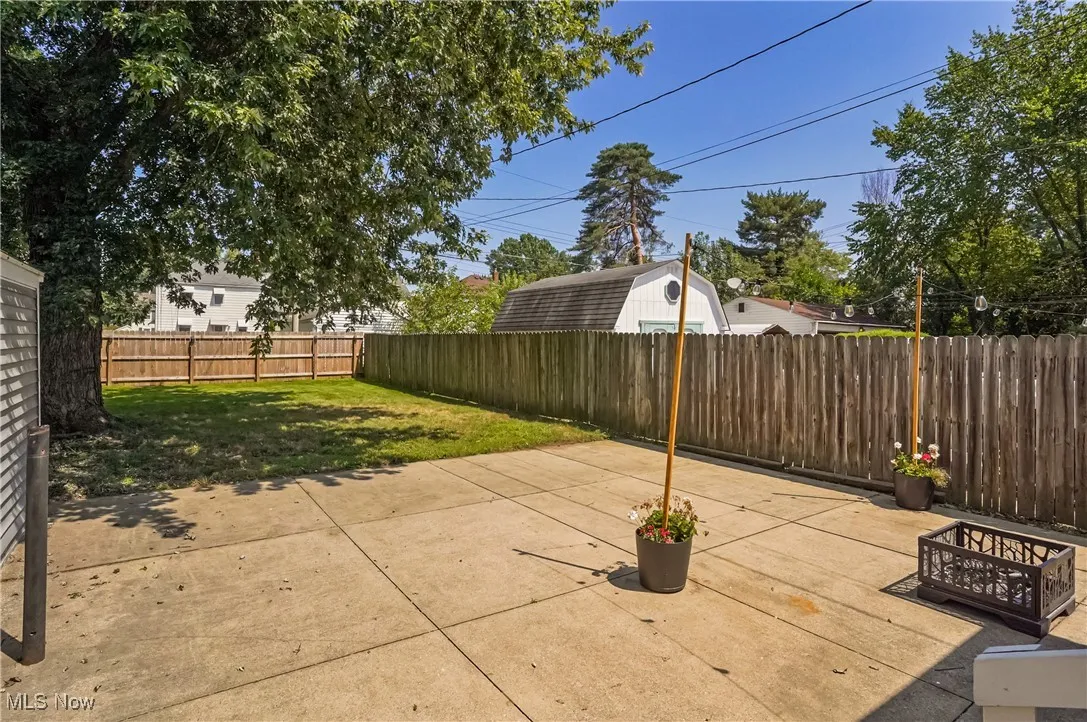 Fenced backyard featuring a patio
